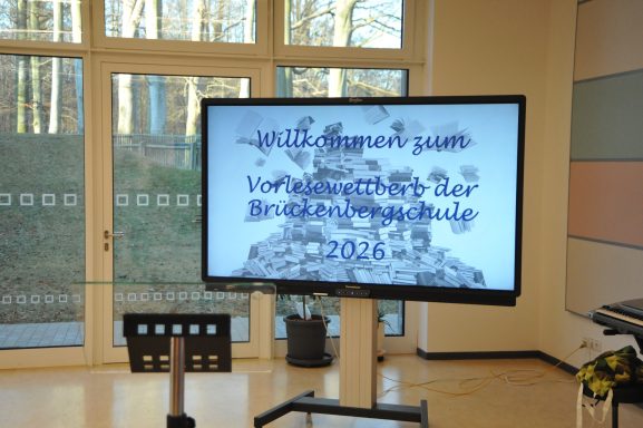 Text auf einem Bildschirm: "Willkommen zu der Veranstaltung am 20.12.2016".